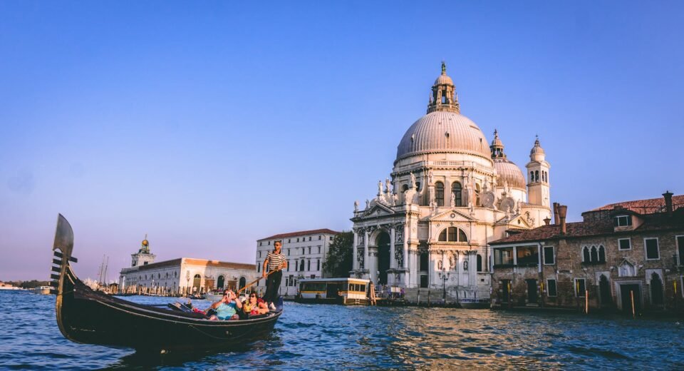 Scenic view of a gondola ride with Santa Maria della Salute in the background, Venice.