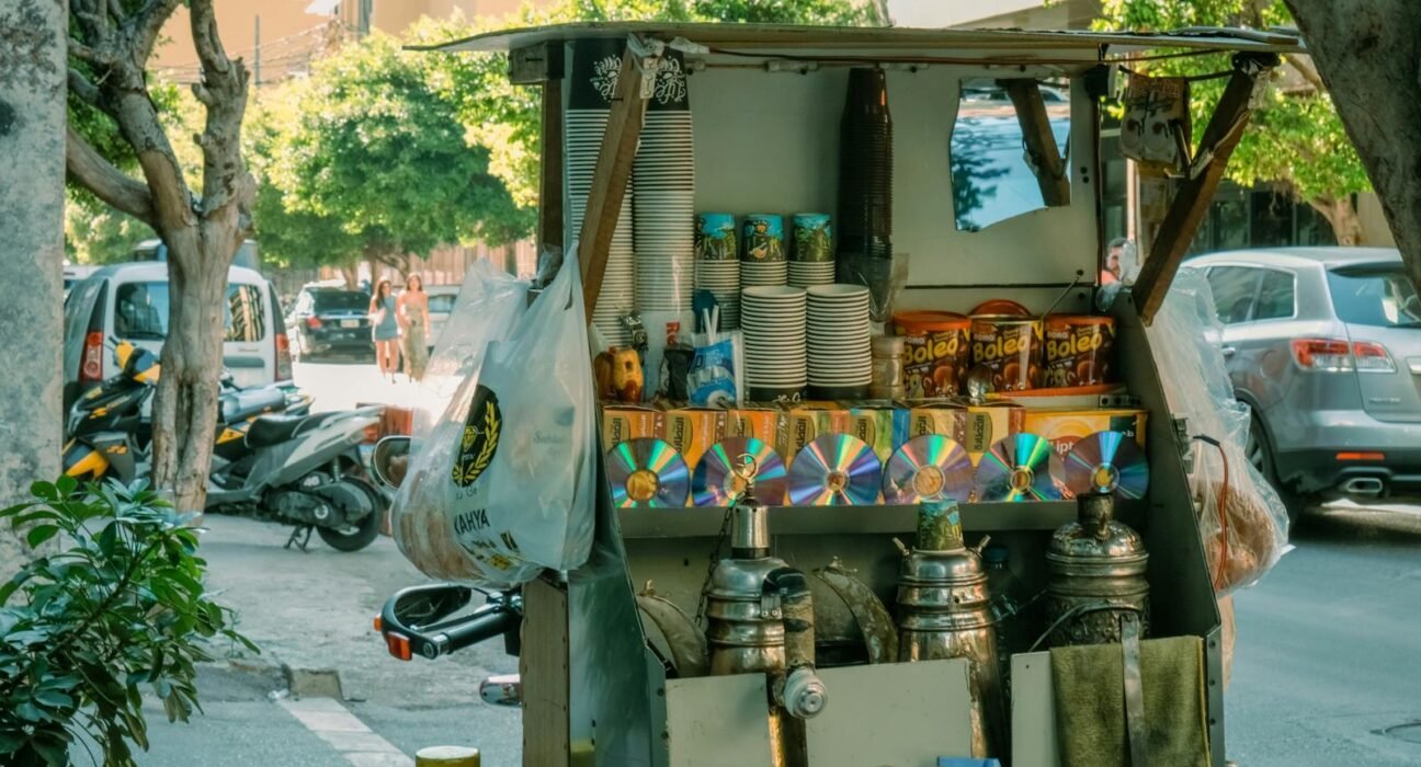 Candid street market scene in Beirut displaying various goods at a local booth.