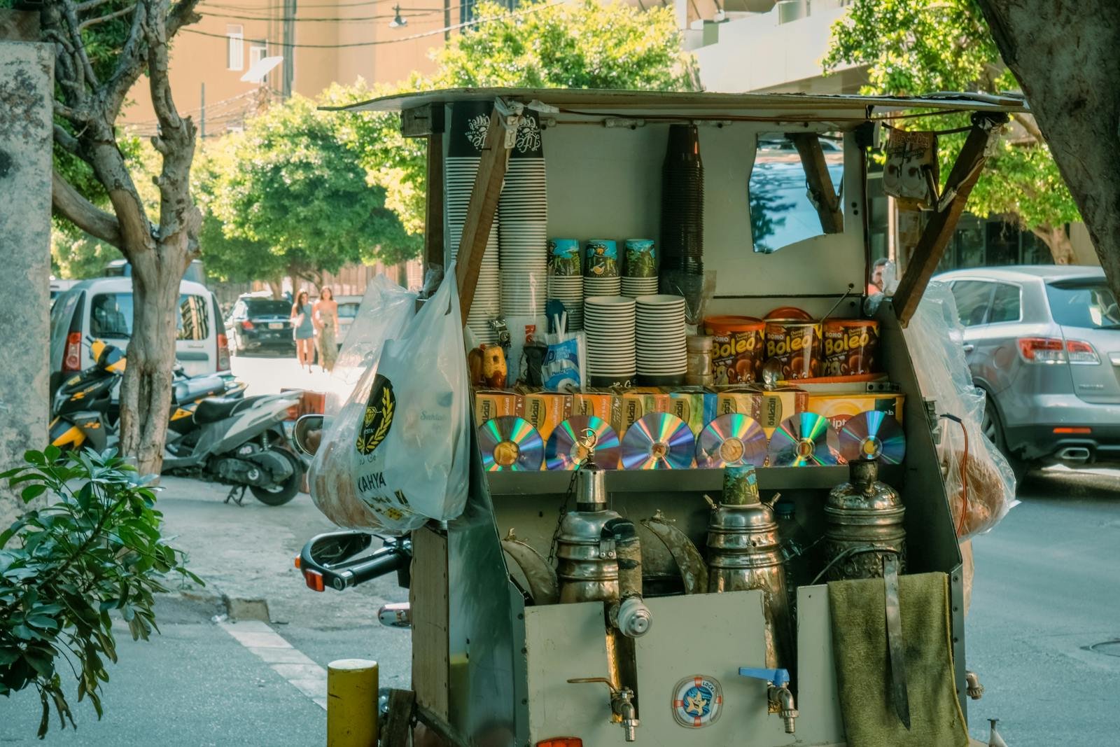 Candid street market scene in Beirut displaying various goods at a local booth.